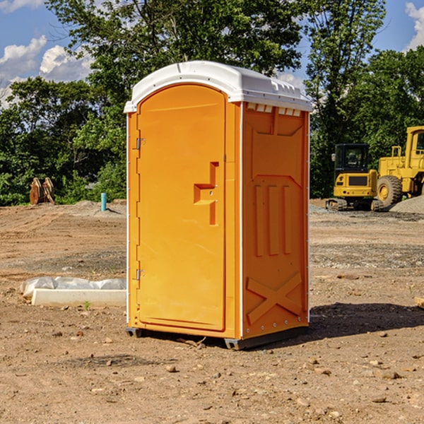 what is the cost difference between standard and deluxe portable toilet rentals in Covert